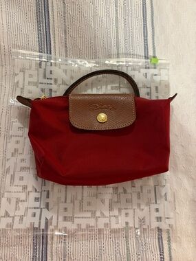 Longchamp cognac le pliage nylon  cosmetic case with flap